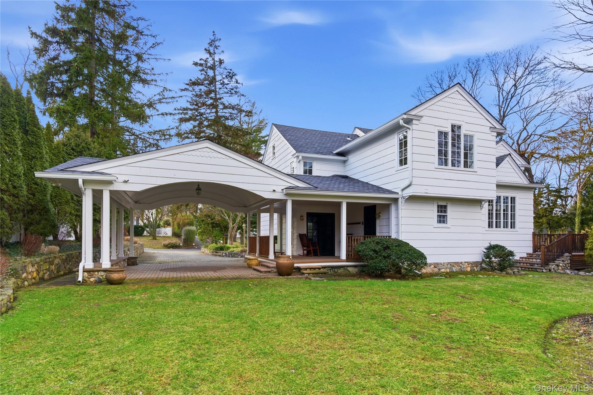 104 Fort Hill Road Huntington, NY 11743 - Photo 30 of 32 a front view of a house with a garden and plants