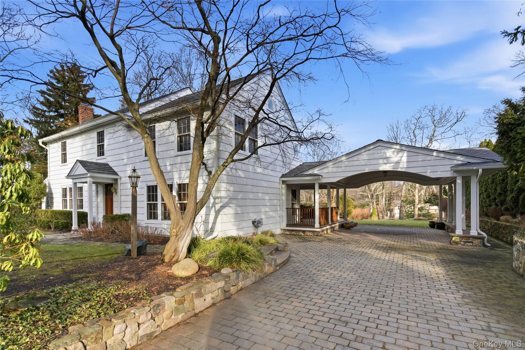 104 Fort Hill Road Huntington, NY 11743 - Photo 5 of 32 a front view of a house with a yard
