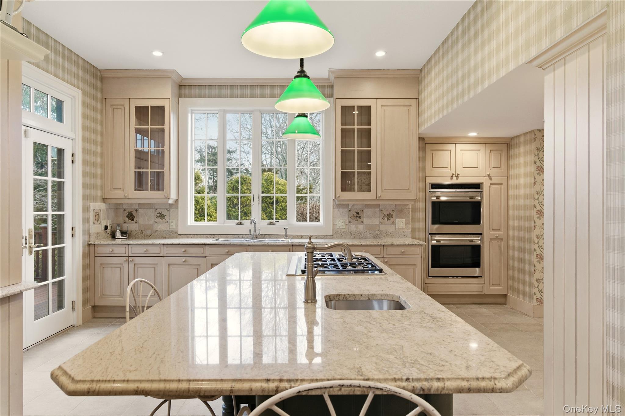 104 Fort Hill Road Huntington, NY 11743 - Photo 7 of 32 a kitchen with stainless steel appliances granite countertop a stove a sink and a microwave