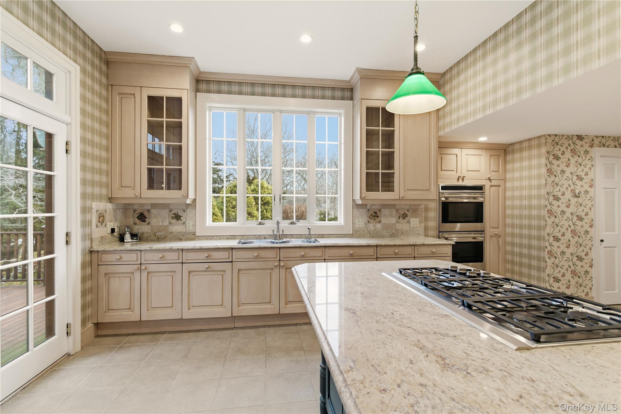 104 Fort Hill Road Huntington, NY 11743 - Photo 8 of 32 a large kitchen with granite countertop a stove and a sink