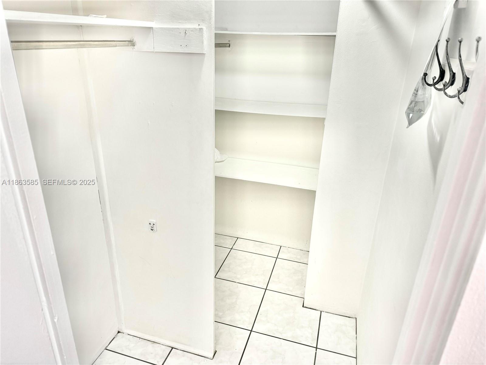 1430 Brickell Bay Drive, Unit 301 Miami, FL 33131 - Photo 12 of 18 a bathroom with a glass shower door