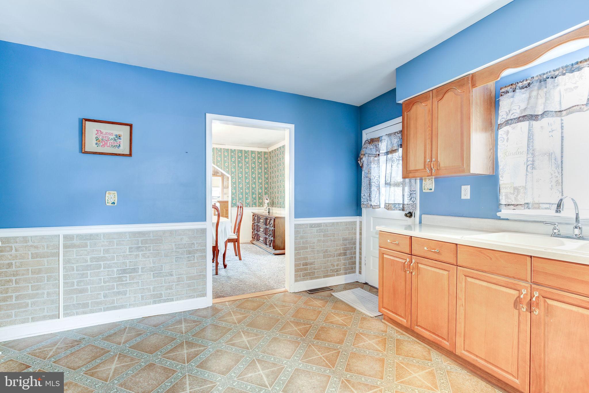 11907 Lime Plant Road New Market, MD 21774 - Photo 12 of 47 a spacious bathroom with a granite countertop sink and a large mirror