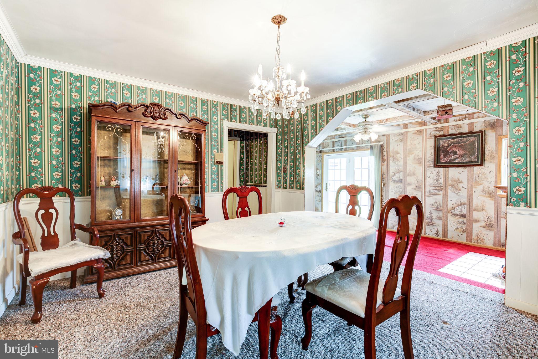 11907 Lime Plant Road New Market, MD 21774 - Photo 16 of 47 a view of a dining room with furniture window and outside view