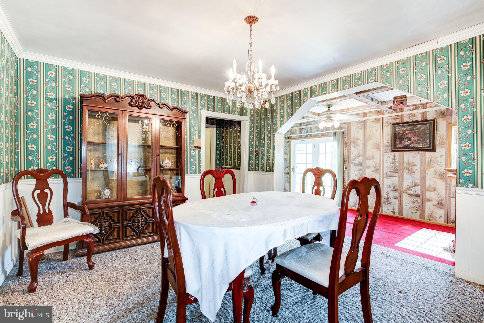 11907 Lime Plant Road New Market, MD 21774 - Photo 17 of 47 a view of a dining room with furniture window and outside view