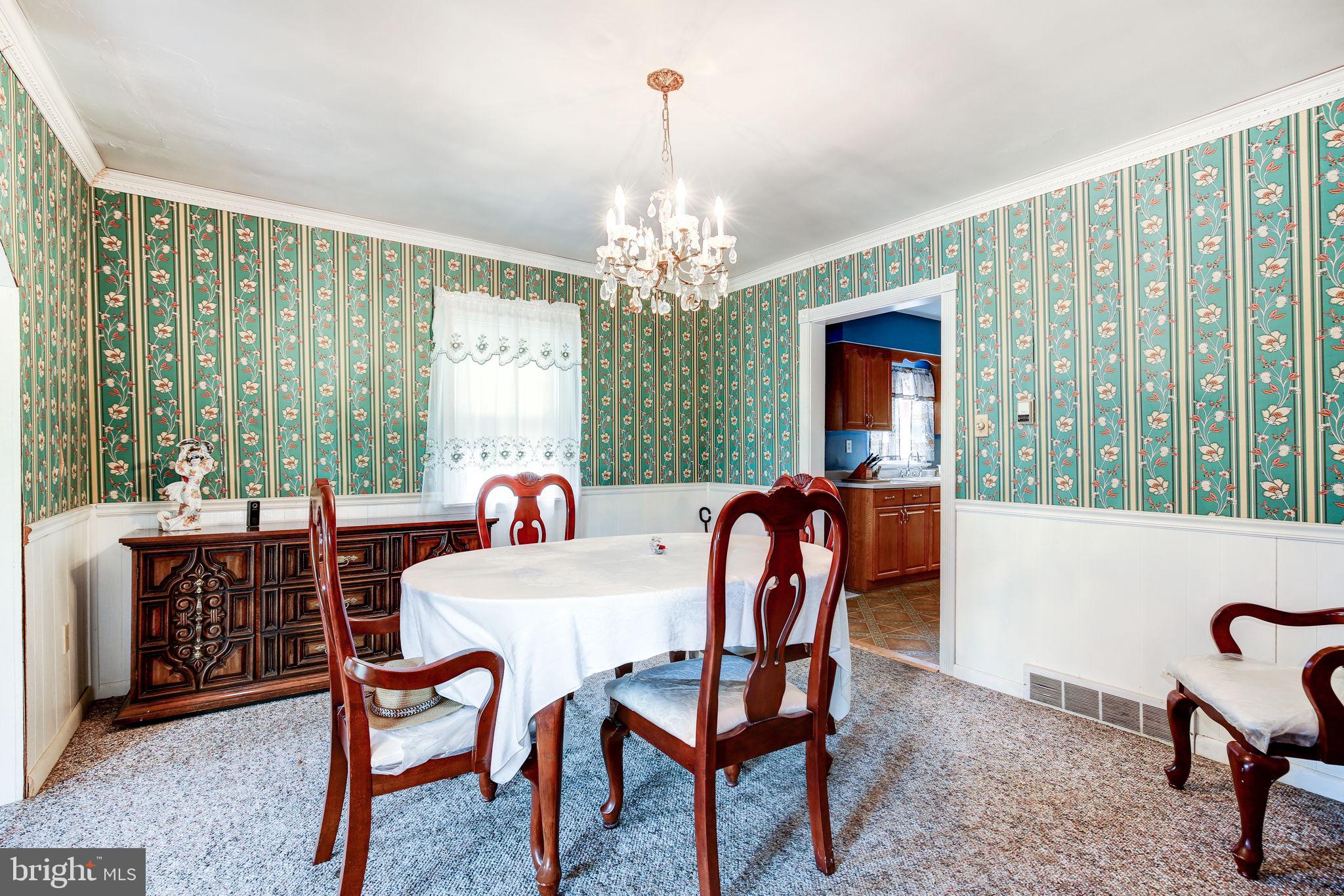 11907 Lime Plant Road New Market, MD 21774 - Photo 18 of 47 a view of a dining room with furniture window and outside view