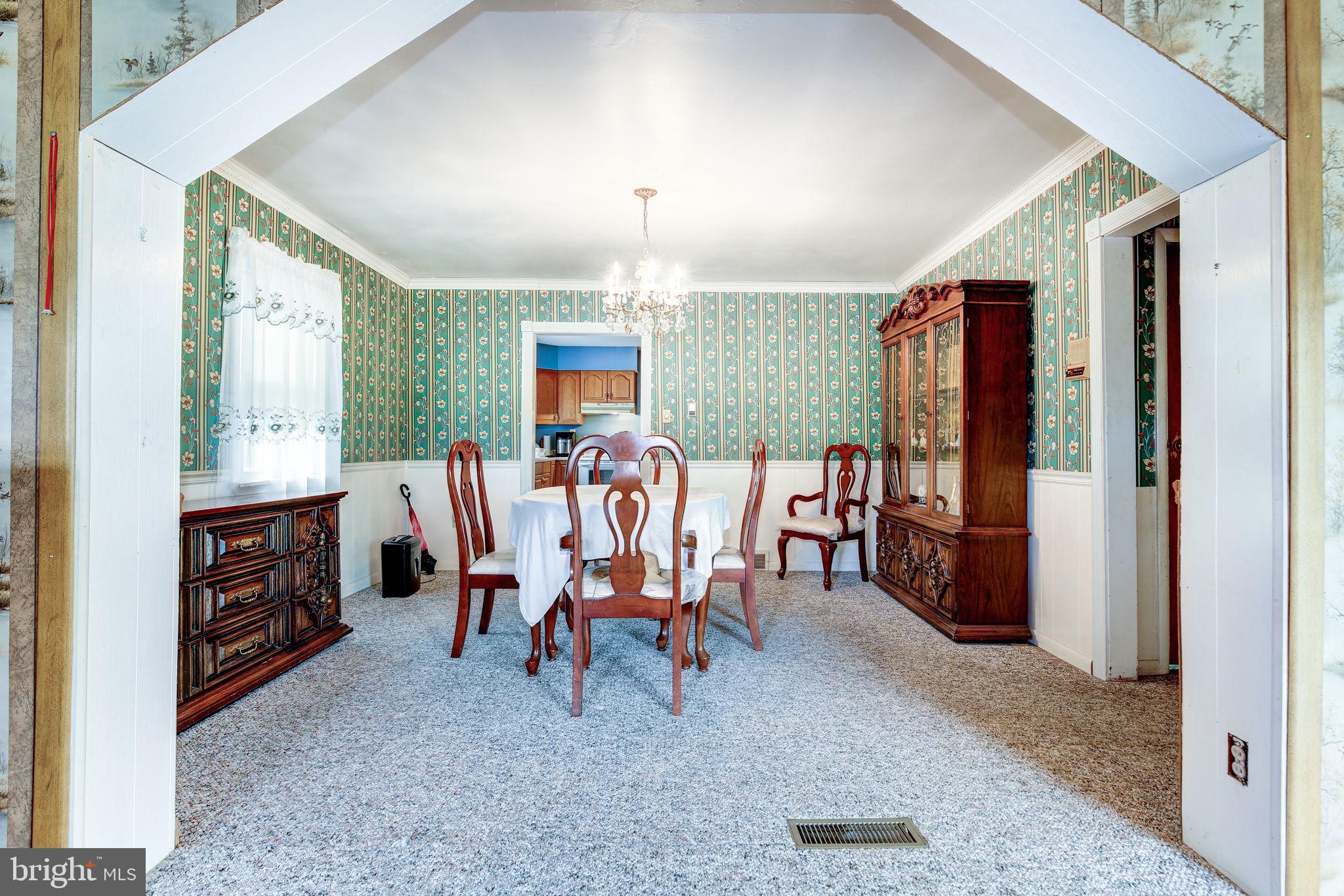11907 Lime Plant Road New Market, MD 21774 - Photo 19 of 47 a view of a dining room with furniture window and outside view