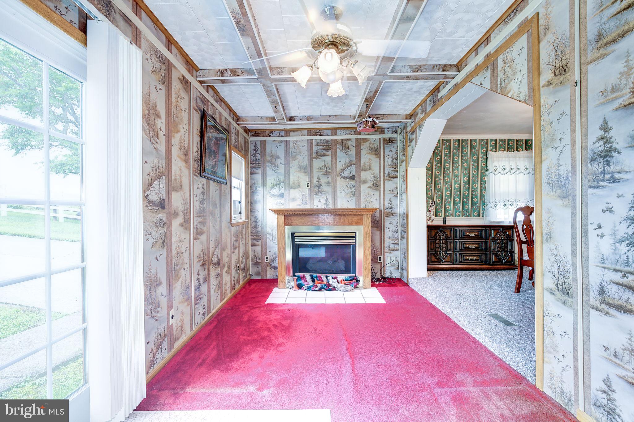 11907 Lime Plant Road New Market, MD 21774 - Photo 21 of 47 a living room with furniture and a fireplace