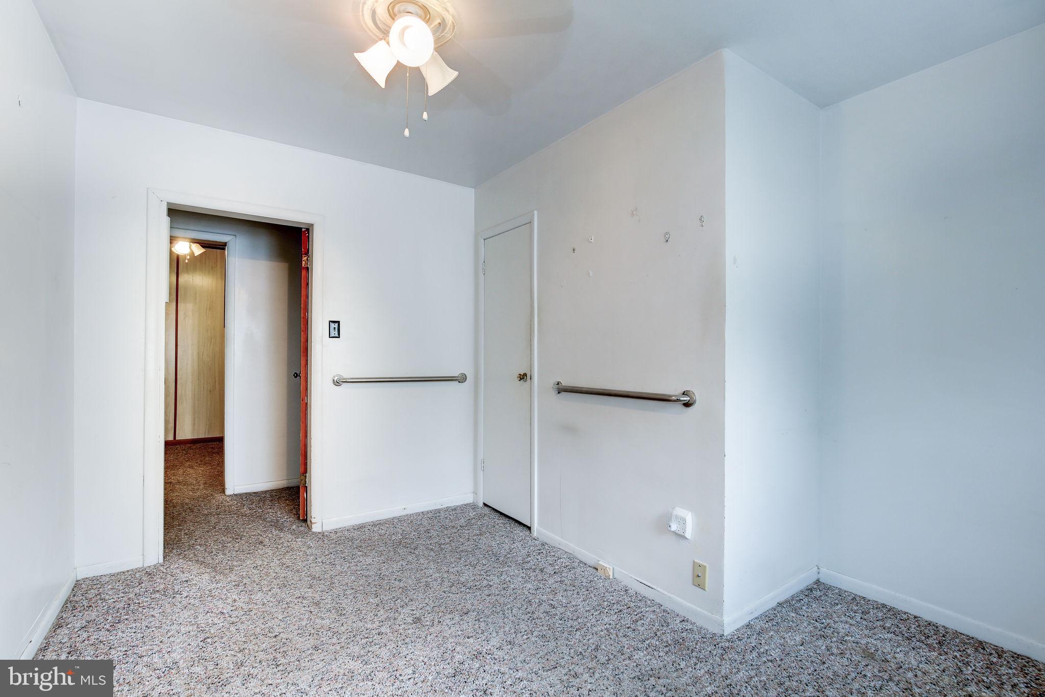 11907 Lime Plant Road New Market, MD 21774 - Photo 22 of 47 a view of a chandelier in an empty room