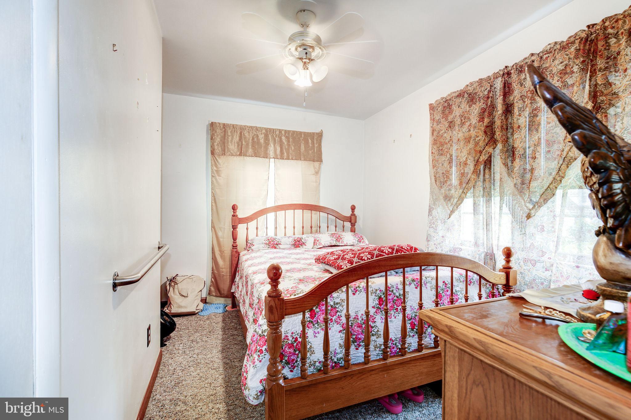 11907 Lime Plant Road New Market, MD 21774 - Photo 23 of 47 a bedroom with furniture and a window