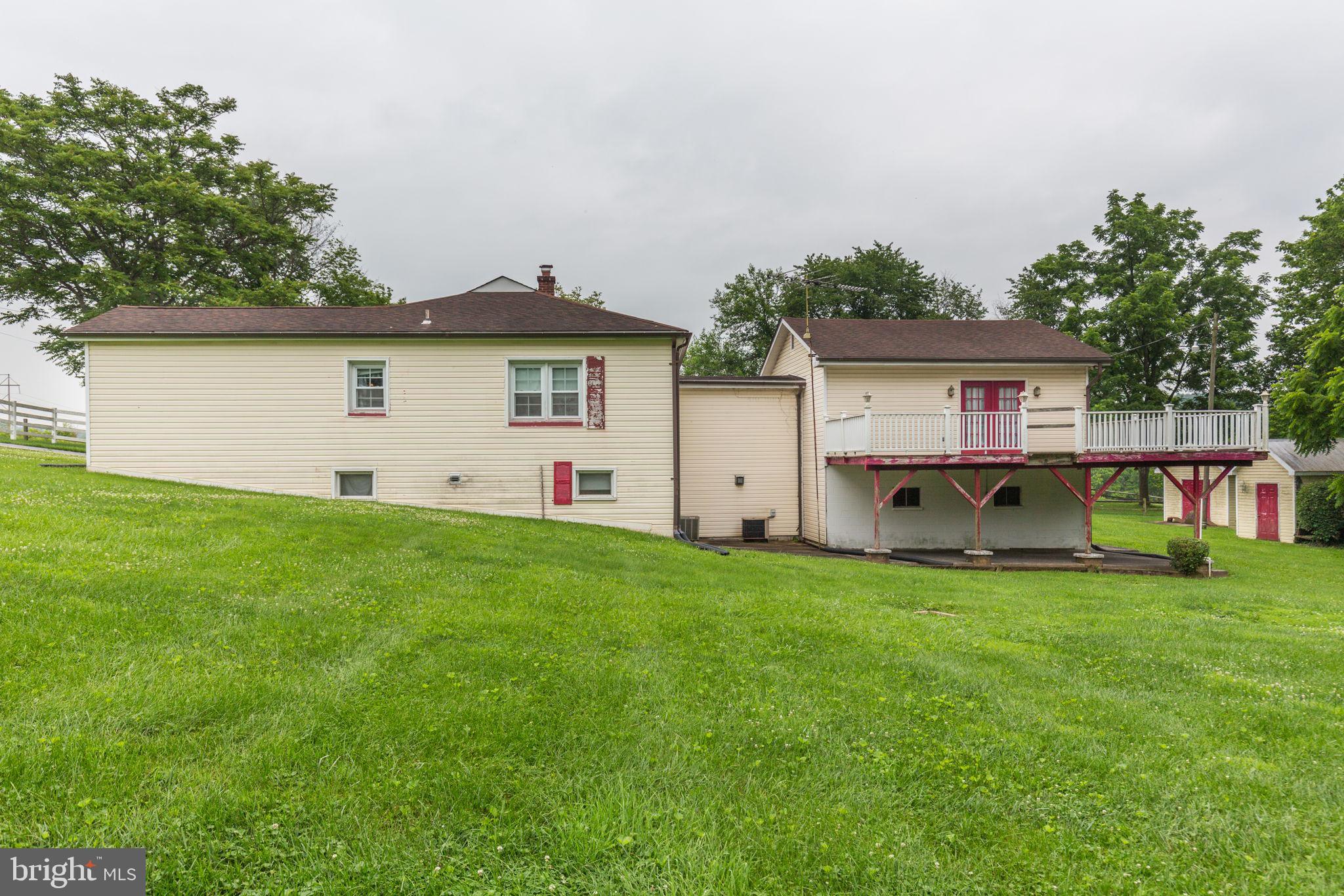 11907 Lime Plant Road New Market, MD 21774 - Photo 3 of 47 a house view with a garden space
