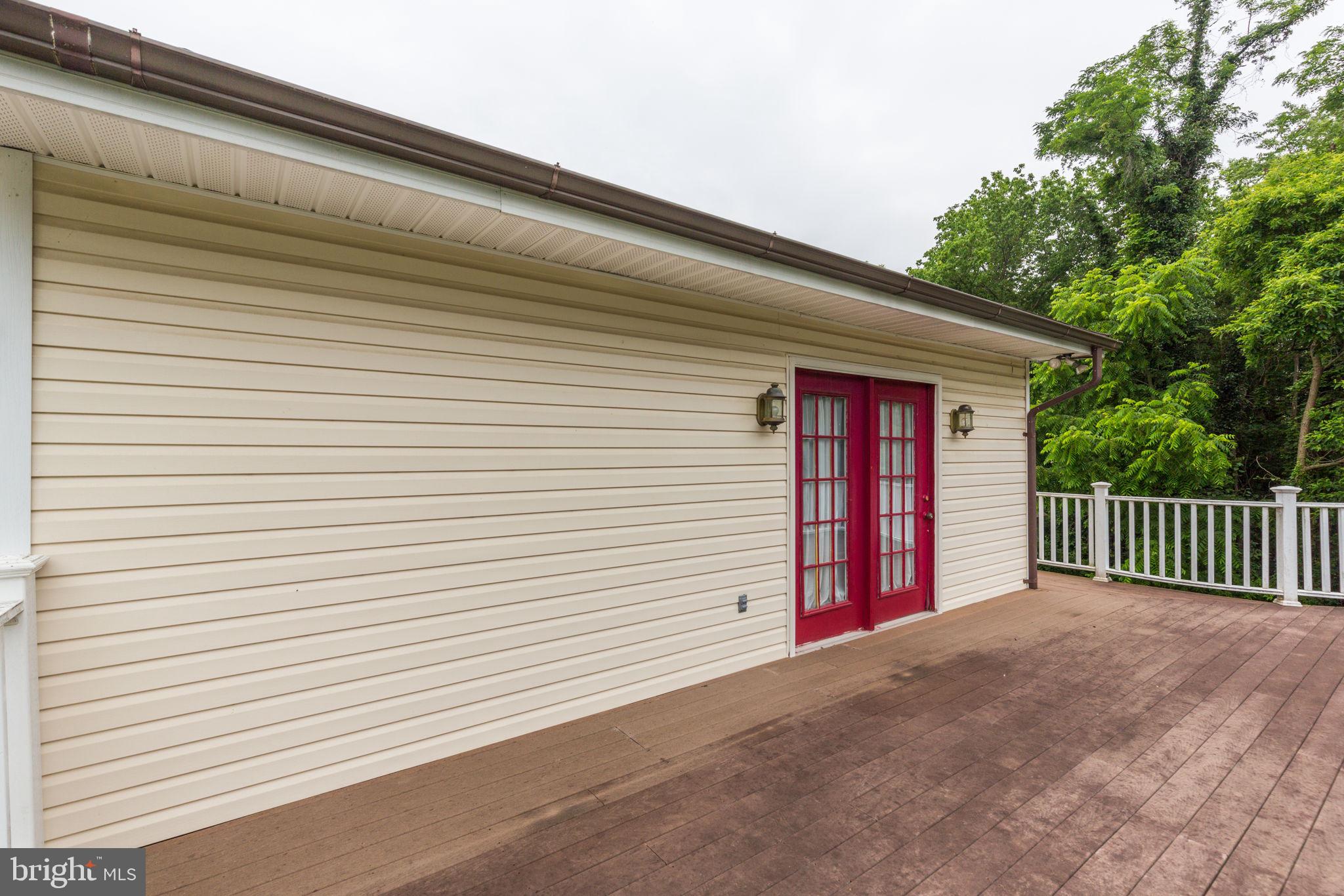 11907 Lime Plant Road New Market, MD 21774 - Photo 44 of 47 a view of a porch with a bench