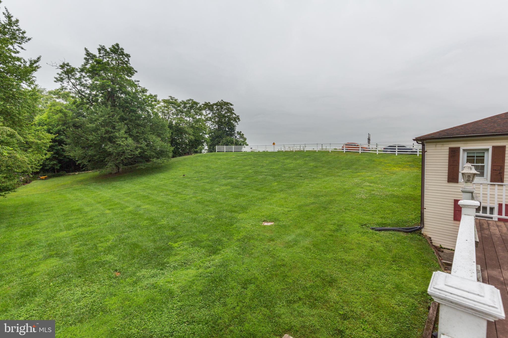 11907 Lime Plant Road New Market, MD 21774 - Photo 46 of 47 a view of a field of grass and trees