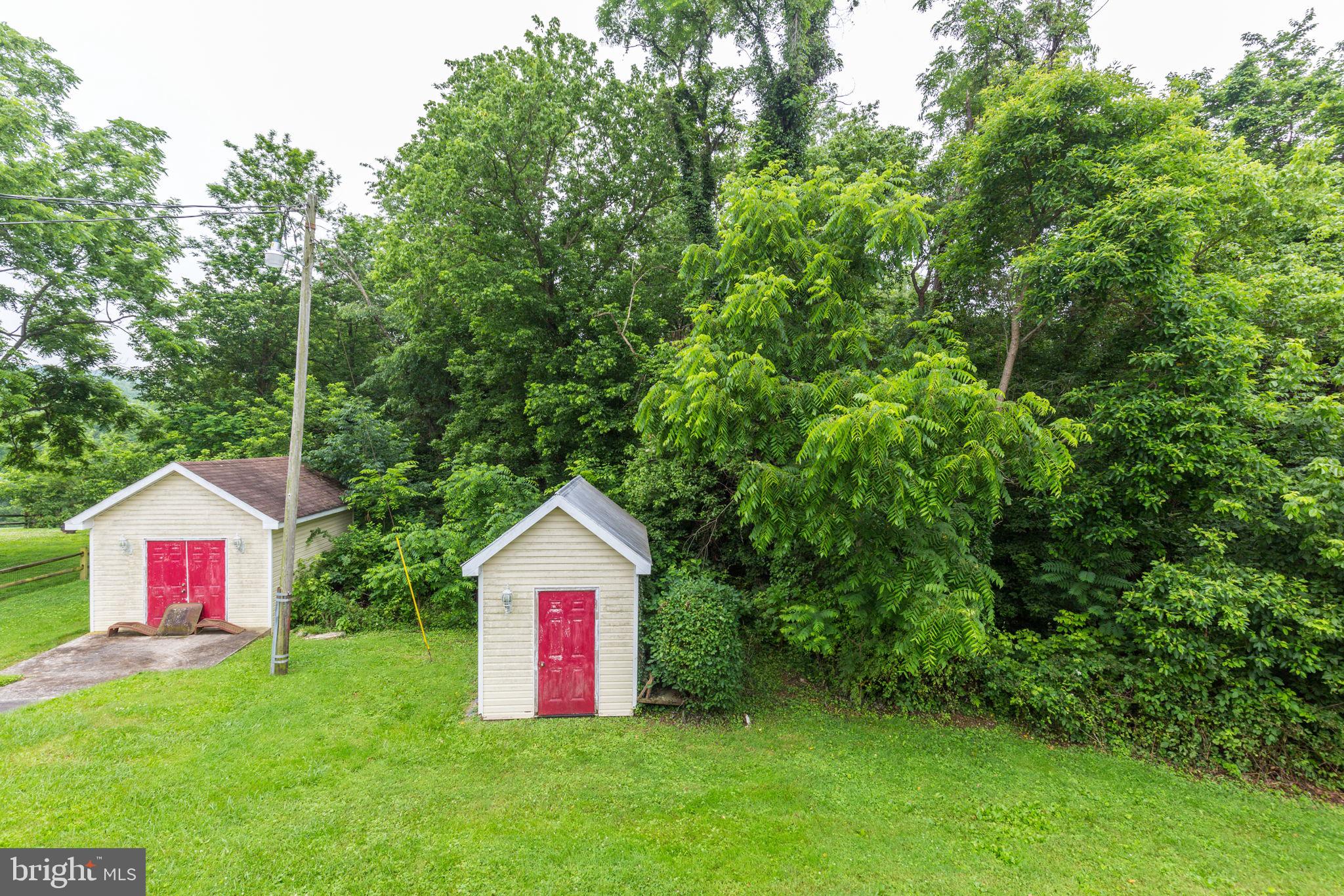 11907 Lime Plant Road New Market, MD 21774 - Photo 47 of 47 a view of a small garden with a house in the background