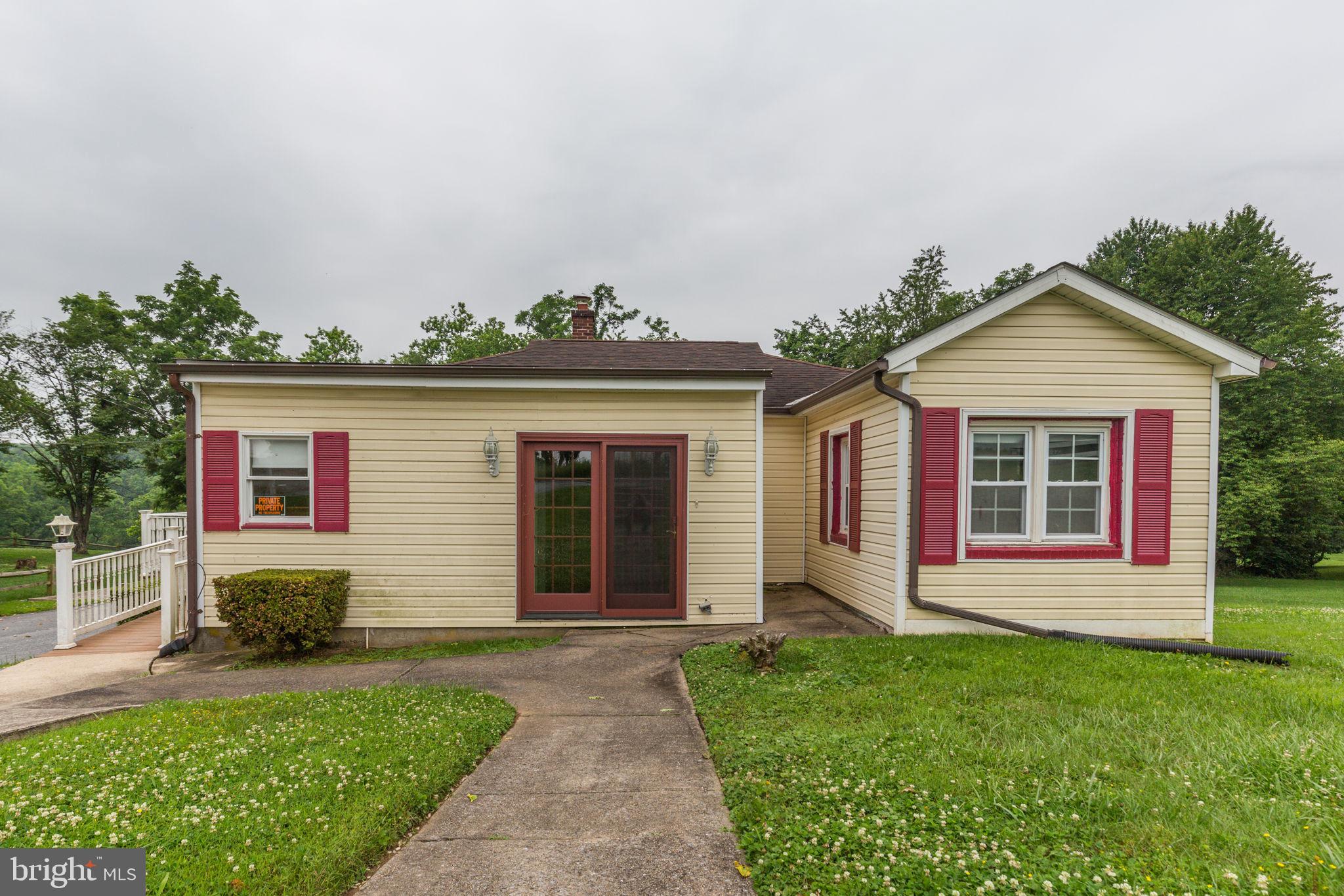 11907 Lime Plant Road New Market, MD 21774 - Photo 5 of 47 front view of a house with a yard