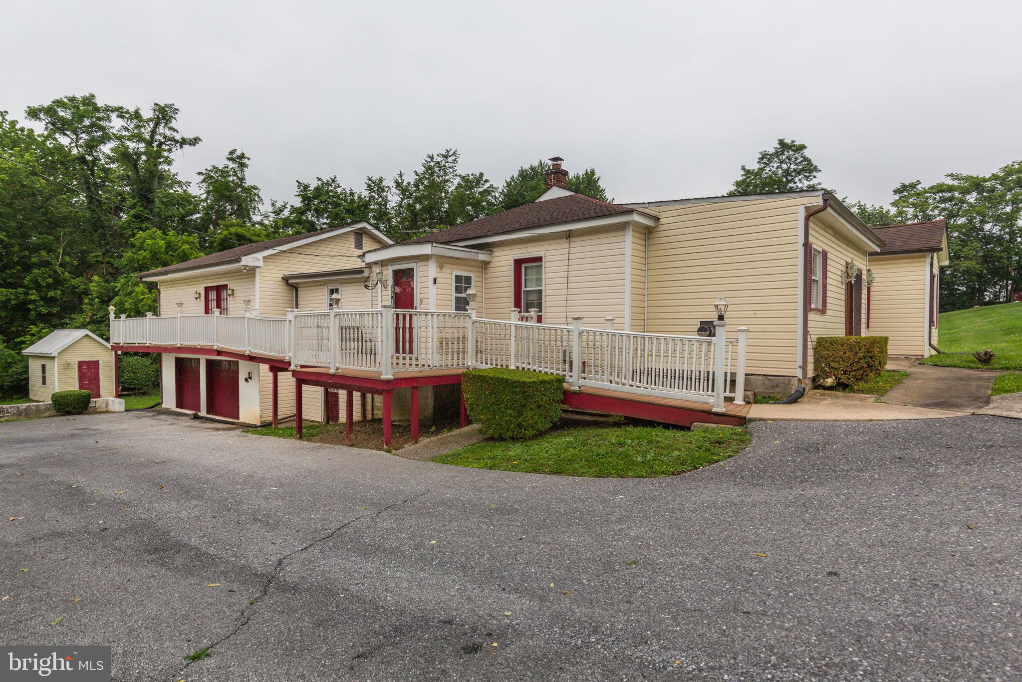 11907 Lime Plant Road New Market, MD 21774 - Photo 9 of 47 a view of house with a yard and potted plants