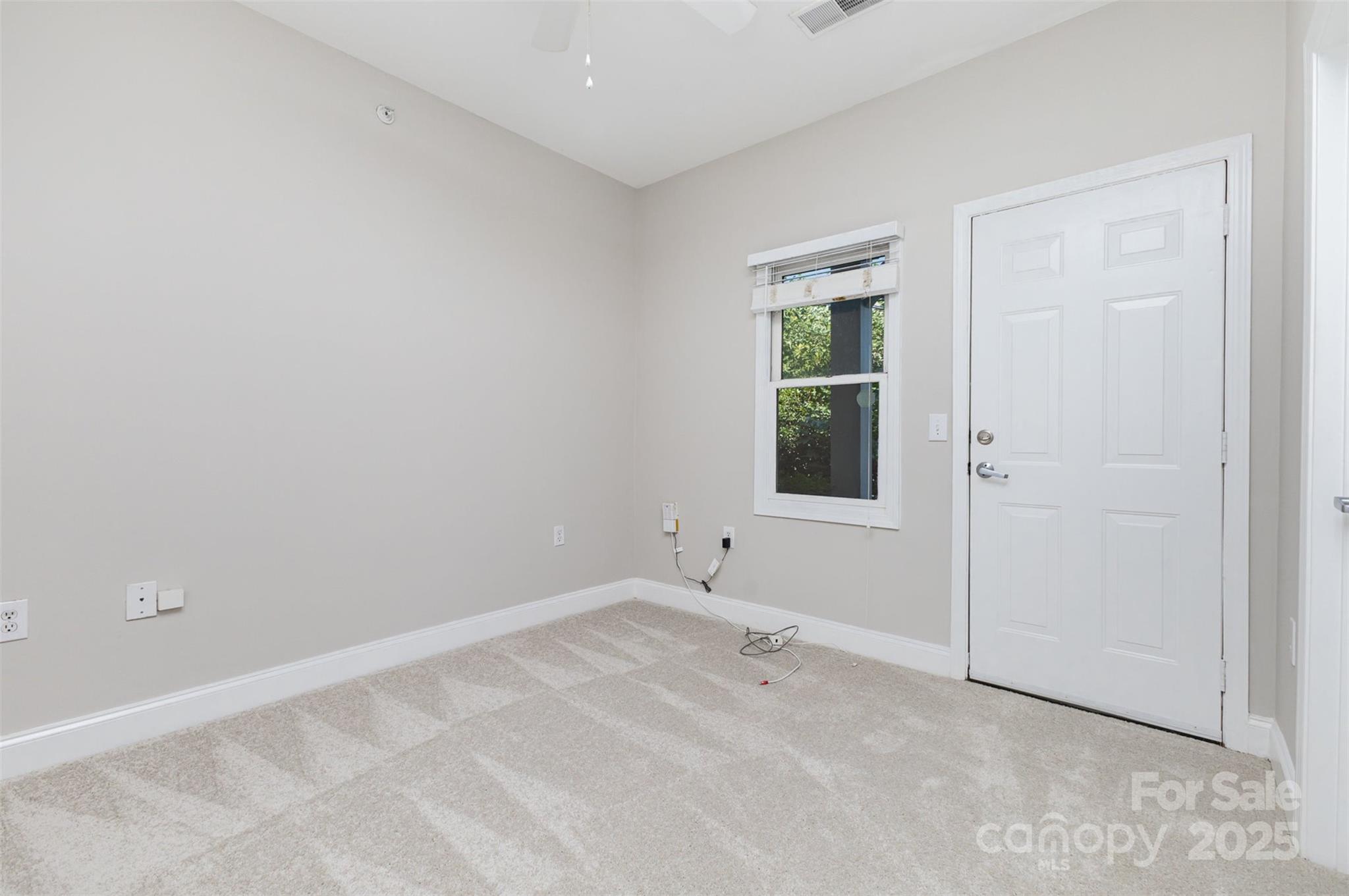 769 Grandin Road Charlotte, NC 28208 - Photo 12 of 17 an empty room with windows