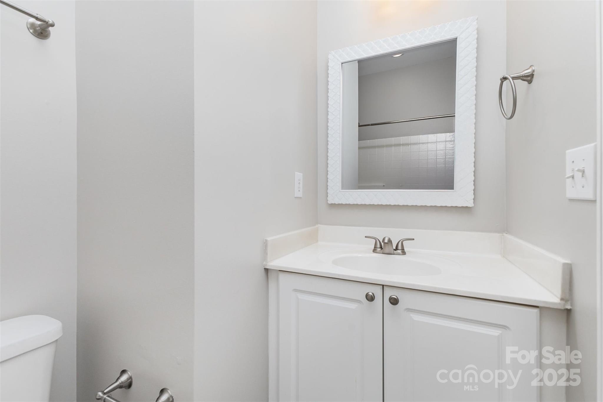 769 Grandin Road Charlotte, NC 28208 - Photo 13 of 17 a bathroom with a sink toilet and vanity