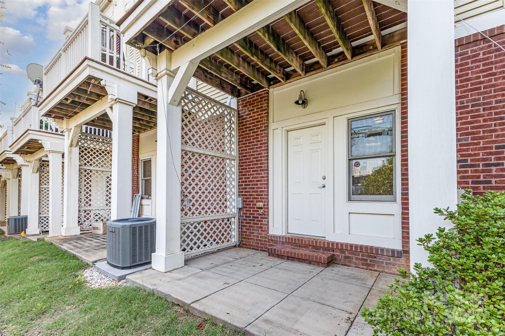 769 Grandin Road Charlotte, NC 28208 - Photo 15 of 17 front view of a house with a glass door and outdoor space