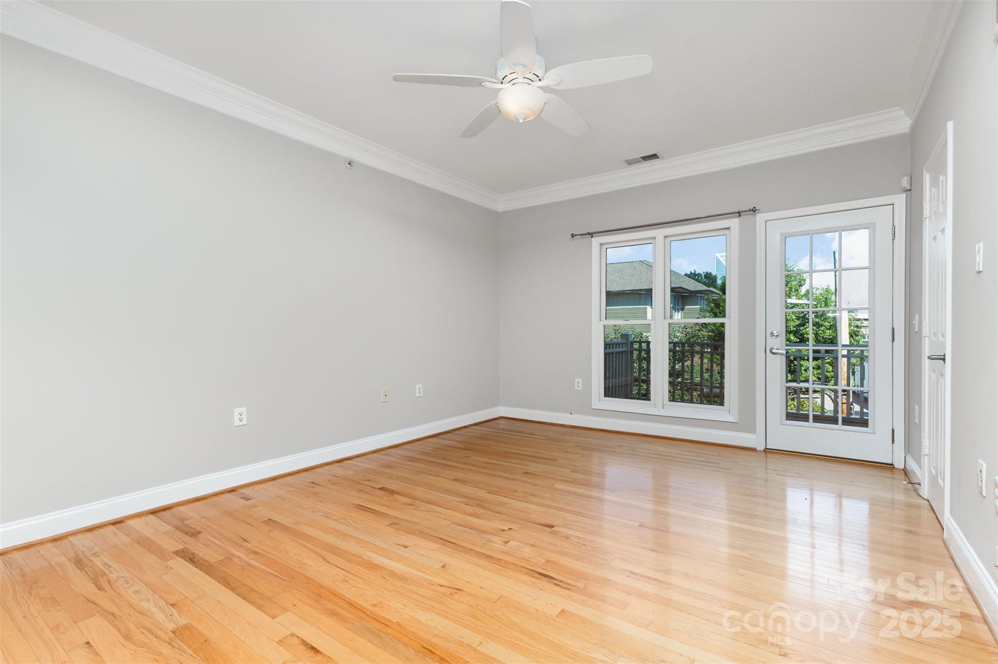769 Grandin Road Charlotte, NC 28208 - Photo 5 of 17 a view of an empty room with a window and wooden floor