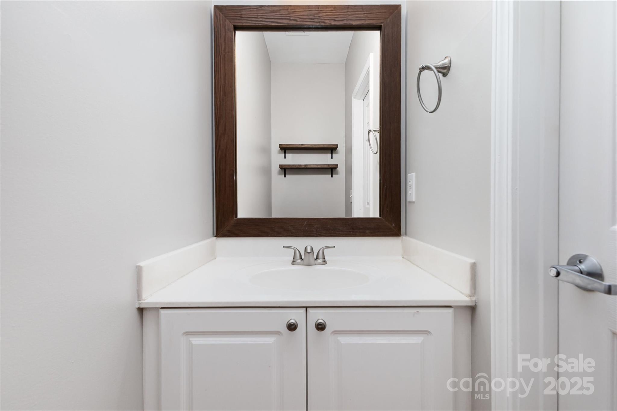 769 Grandin Road Charlotte, NC 28208 - Photo 7 of 17 a bathroom with a sink and a mirror