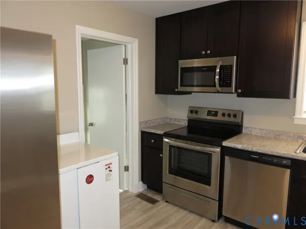 a kitchen with a stove and a microwave