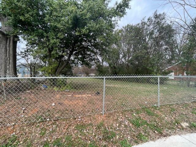 1815 Beatties Ford Road Charlotte, NC 28216 - Photo 3 of 14 a backyard of field and trees