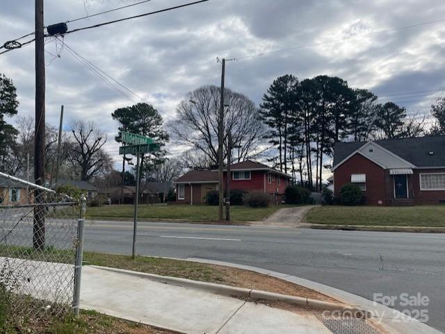1815 Beatties Ford Road Charlotte, NC 28216 - Photo 8 of 14 a view of a house with a yard