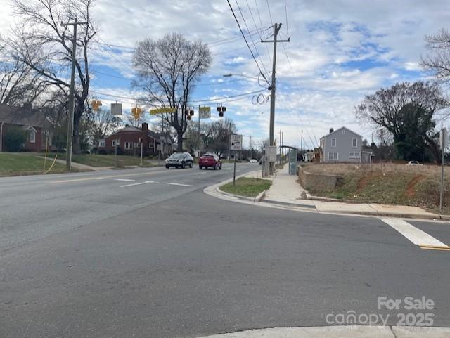 1815 Beatties Ford Road Charlotte, NC 28216 - Photo 10 of 14 a view of a street with houses