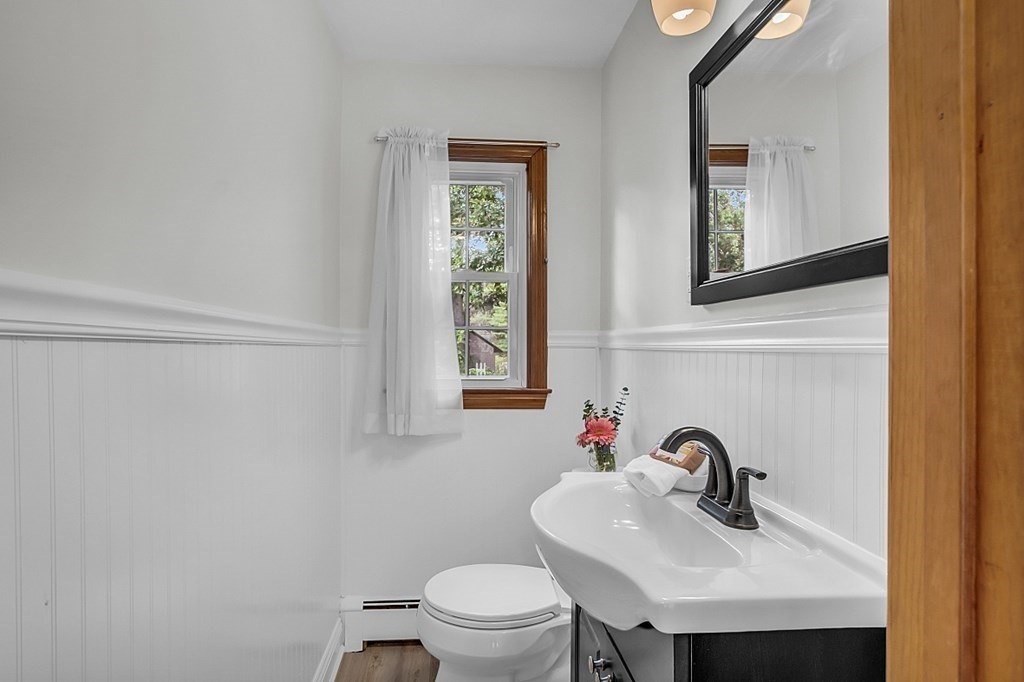 180 County Road Tewksbury, MA 01876 - Photo 17 of 40 a bathroom with a sink a toilet and mirror