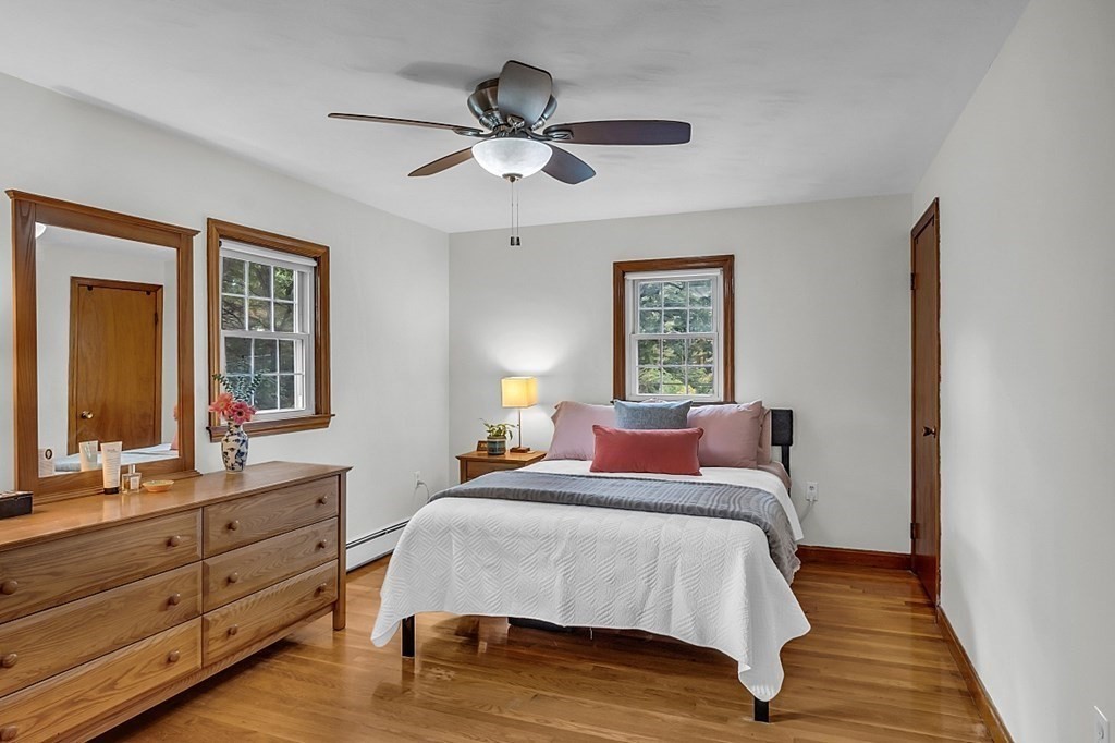 180 County Road Tewksbury, MA 01876 - Photo 18 of 40 a bedroom with a bed and a dresser