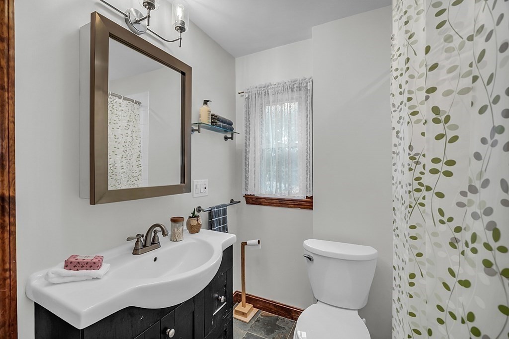 180 County Road Tewksbury, MA 01876 - Photo 26 of 40 a bathroom with a sink toilet and a mirror