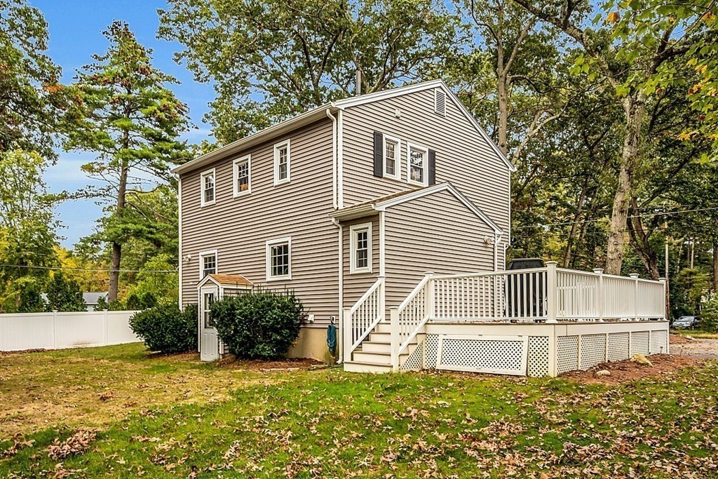 180 County Road Tewksbury, MA 01876 - Photo 3 of 40 a house that has a tree in front of the house