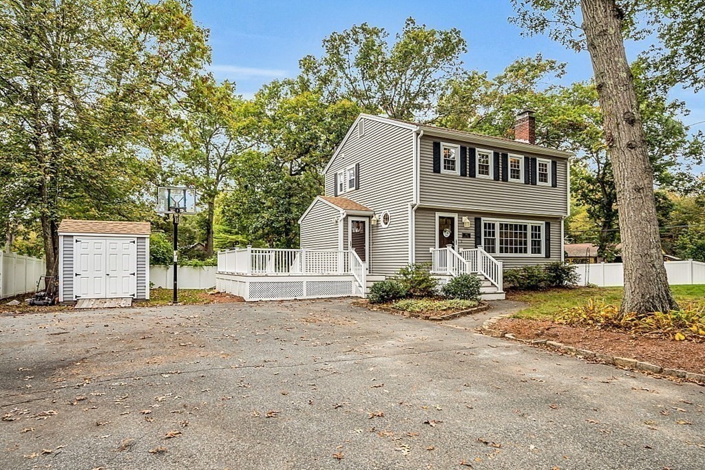180 County Road Tewksbury, MA 01876 - Photo 38 of 40 a front view of a house with a yard