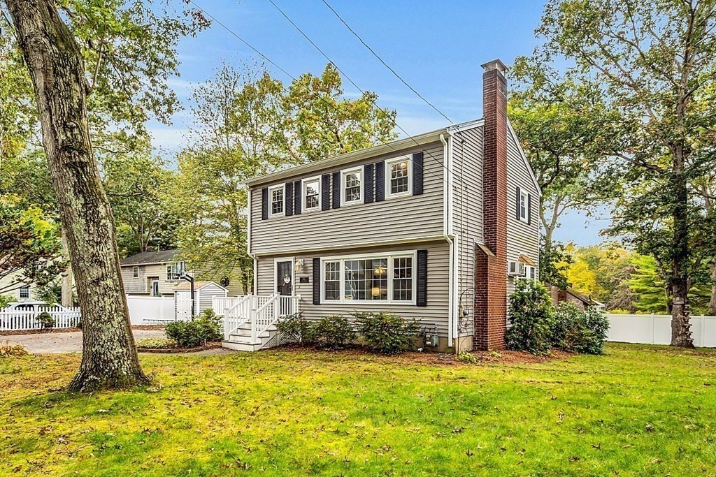 180 County Road Tewksbury, MA 01876 - Photo 40 of 40 a front view of a house with a yard and garage