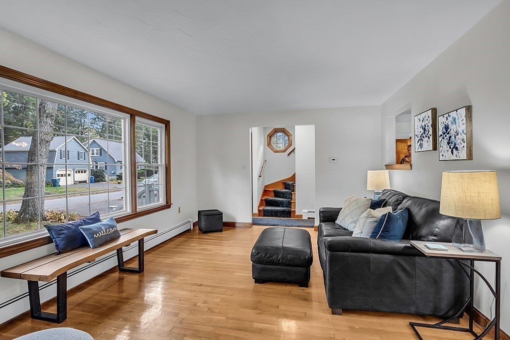180 County Road Tewksbury, MA 01876 - Photo 6 of 40 a living room with furniture and a large window