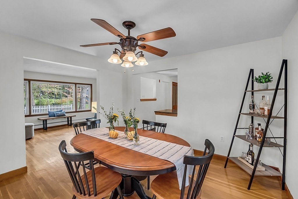 180 County Road Tewksbury, MA 01876 - Photo 8 of 40 a dining room with furniture a chandelier and wooden floor