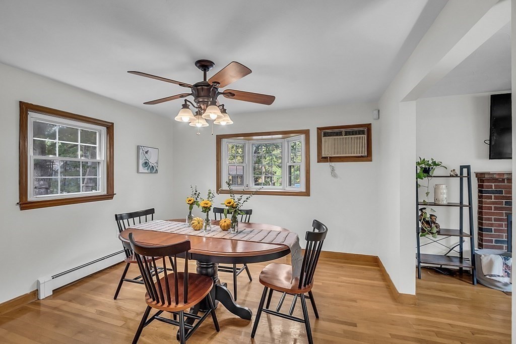 180 County Road Tewksbury, MA 01876 - Photo 9 of 40 a view of a dining room with furniture and wooden floor