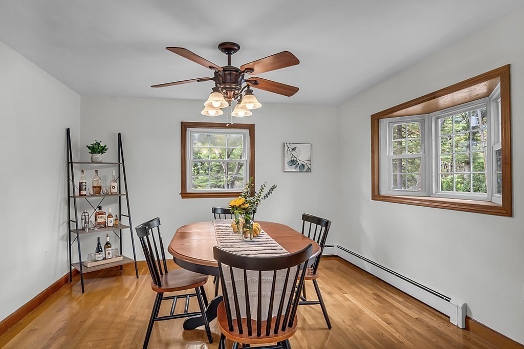 180 County Road Tewksbury, MA 01876 - Photo 10 of 40 a view of a dining room with furniture window and wooden floor