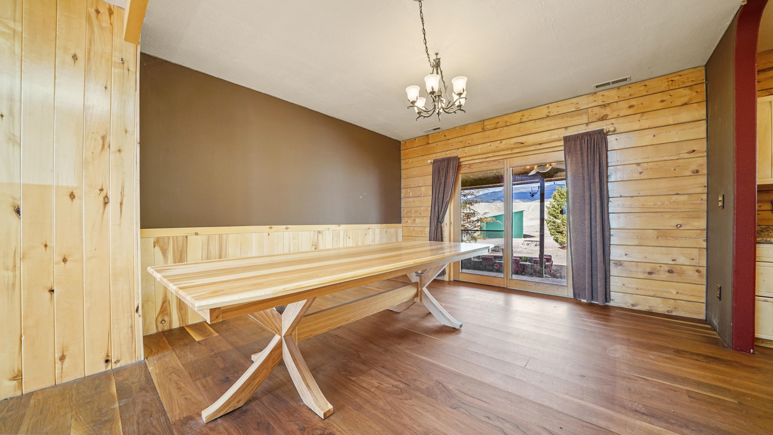 863 1400th Lane Delta, CO 81416 - Photo 11 of 42 a room with wooden floor and windows