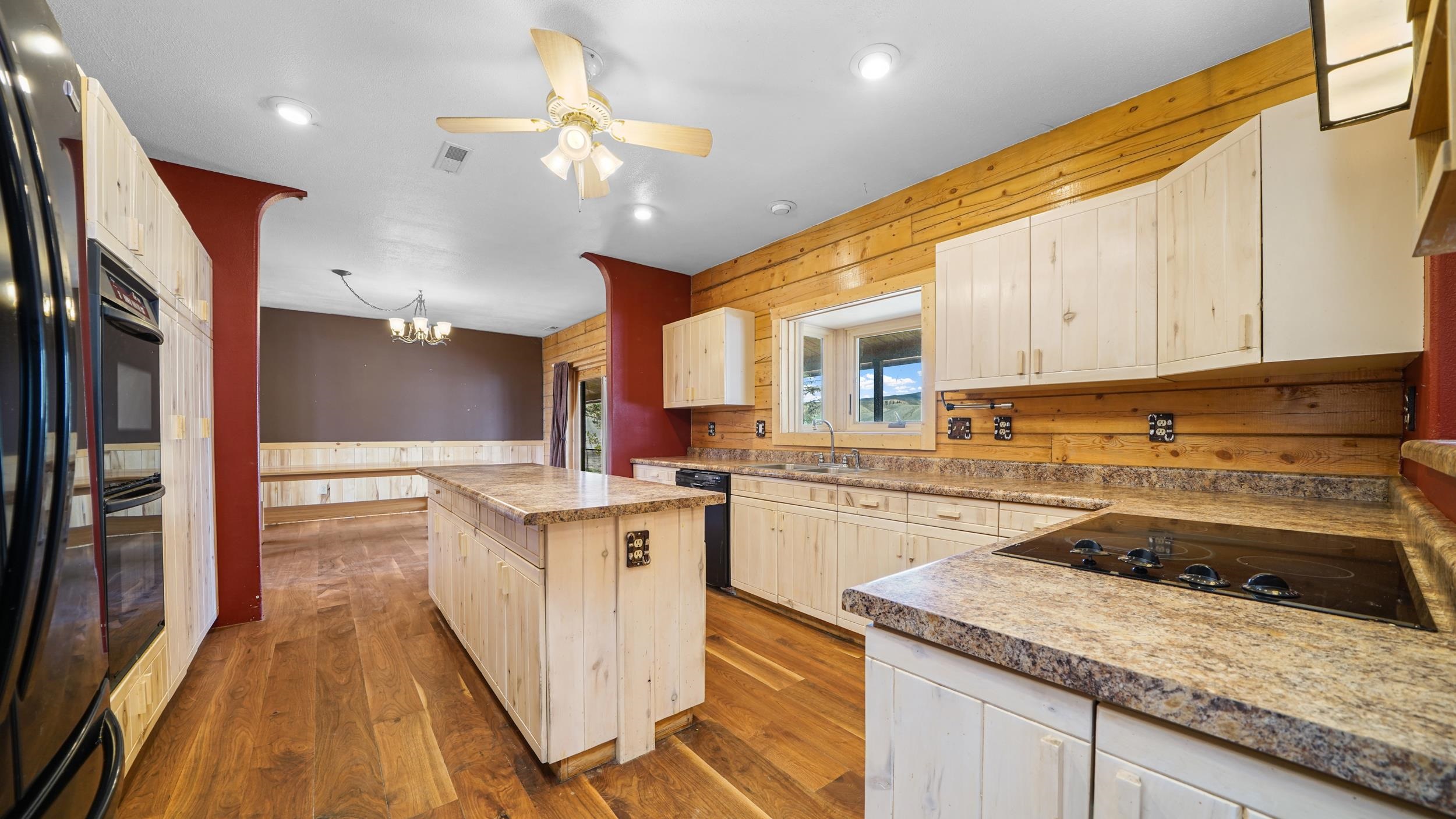 863 1400th Lane Delta, CO 81416 - Photo 14 of 42 a kitchen with stainless steel appliances granite countertop a sink a stove and a refrigerator