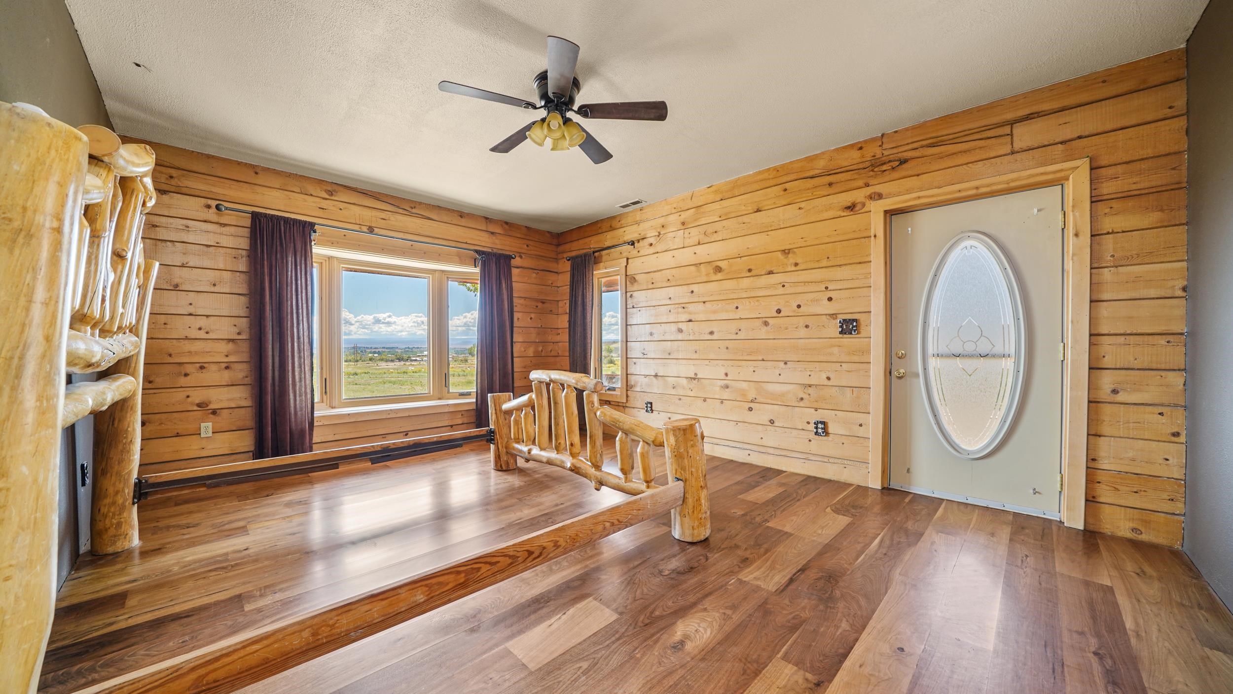 863 1400th Lane Delta, CO 81416 - Photo 16 of 42 a view of a livingroom with furniture wooden floor and window