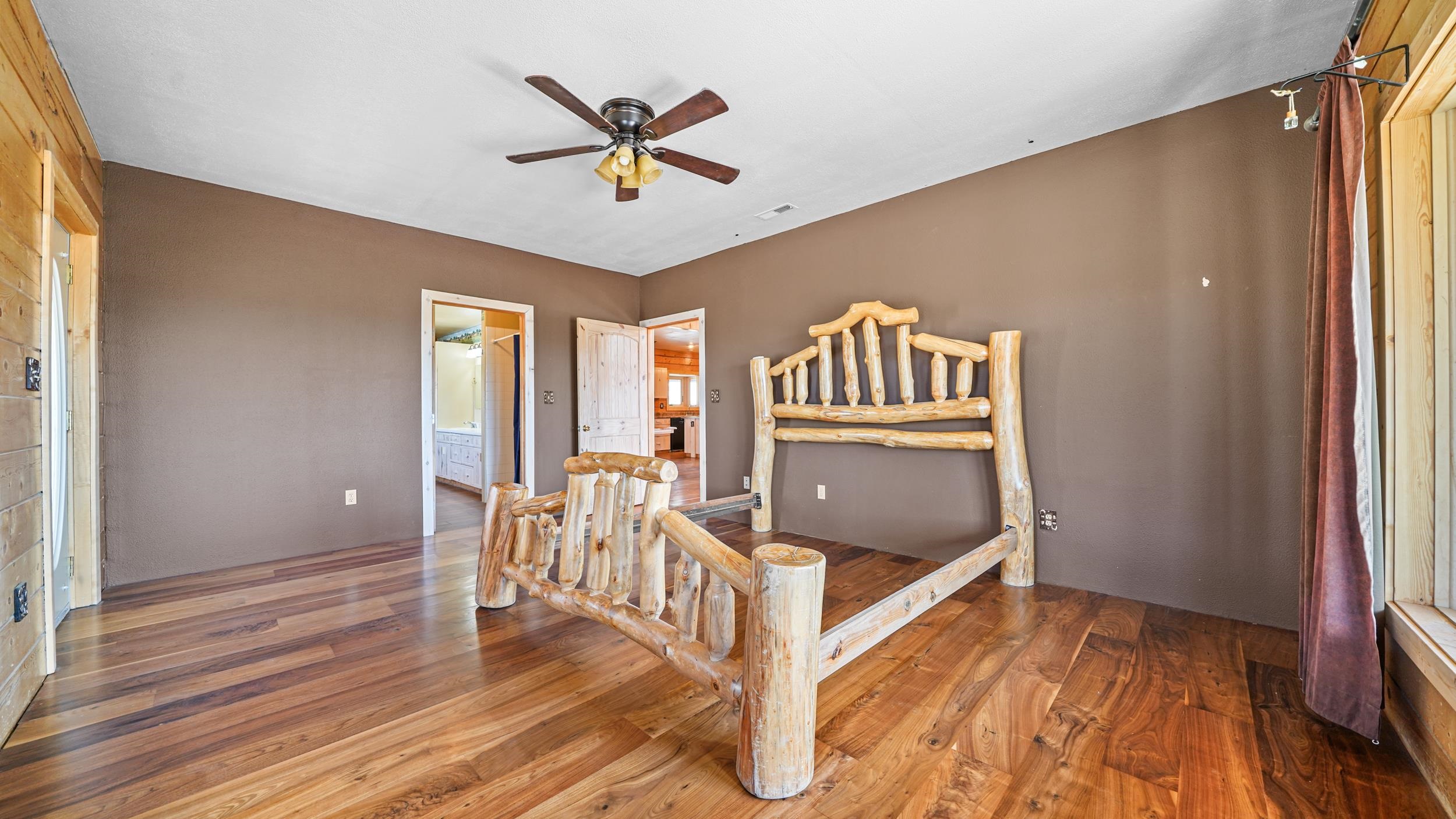 863 1400th Lane Delta, CO 81416 - Photo 17 of 42 a view of a hallway with wooden floor and stairs
