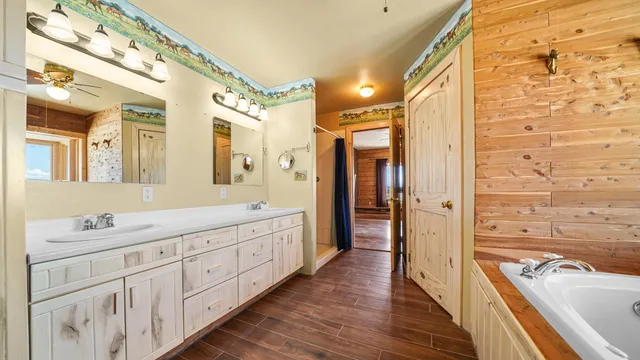 a view of room with cabinet and ceiling fan