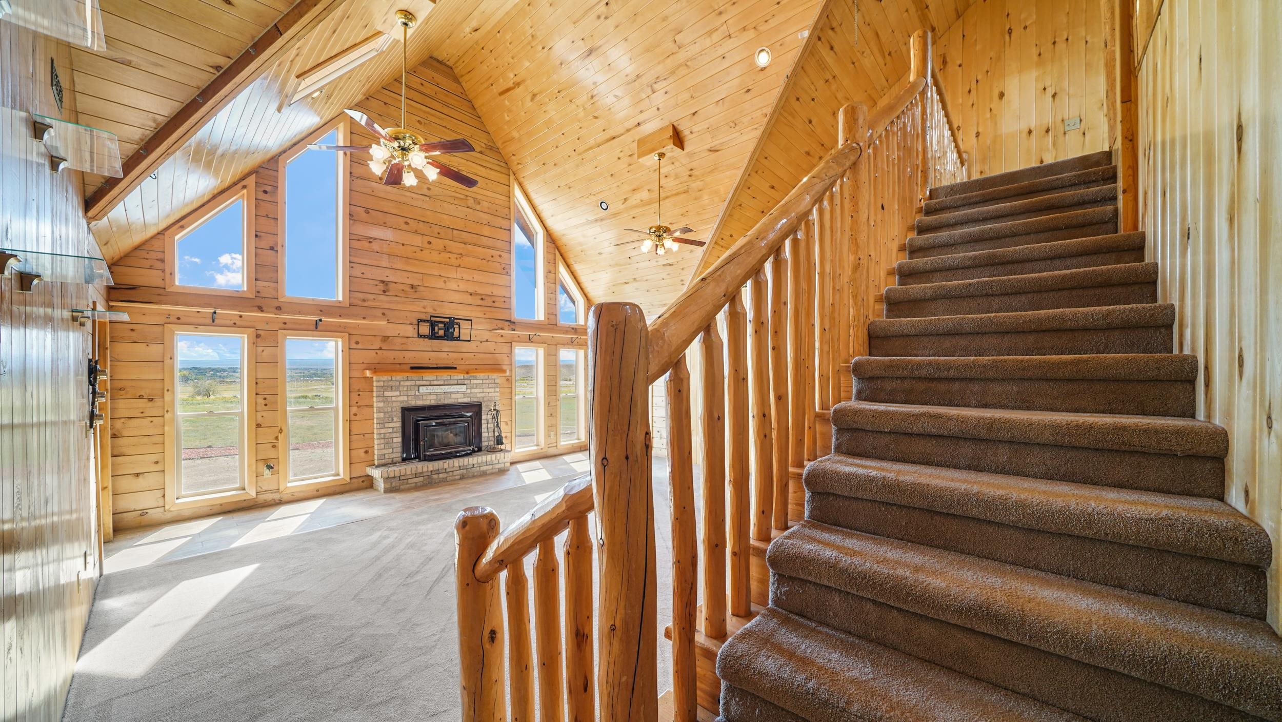 863 1400th Lane Delta, CO 81416 - Photo 23 of 42 a view of a entryway with stairs and a fireplace