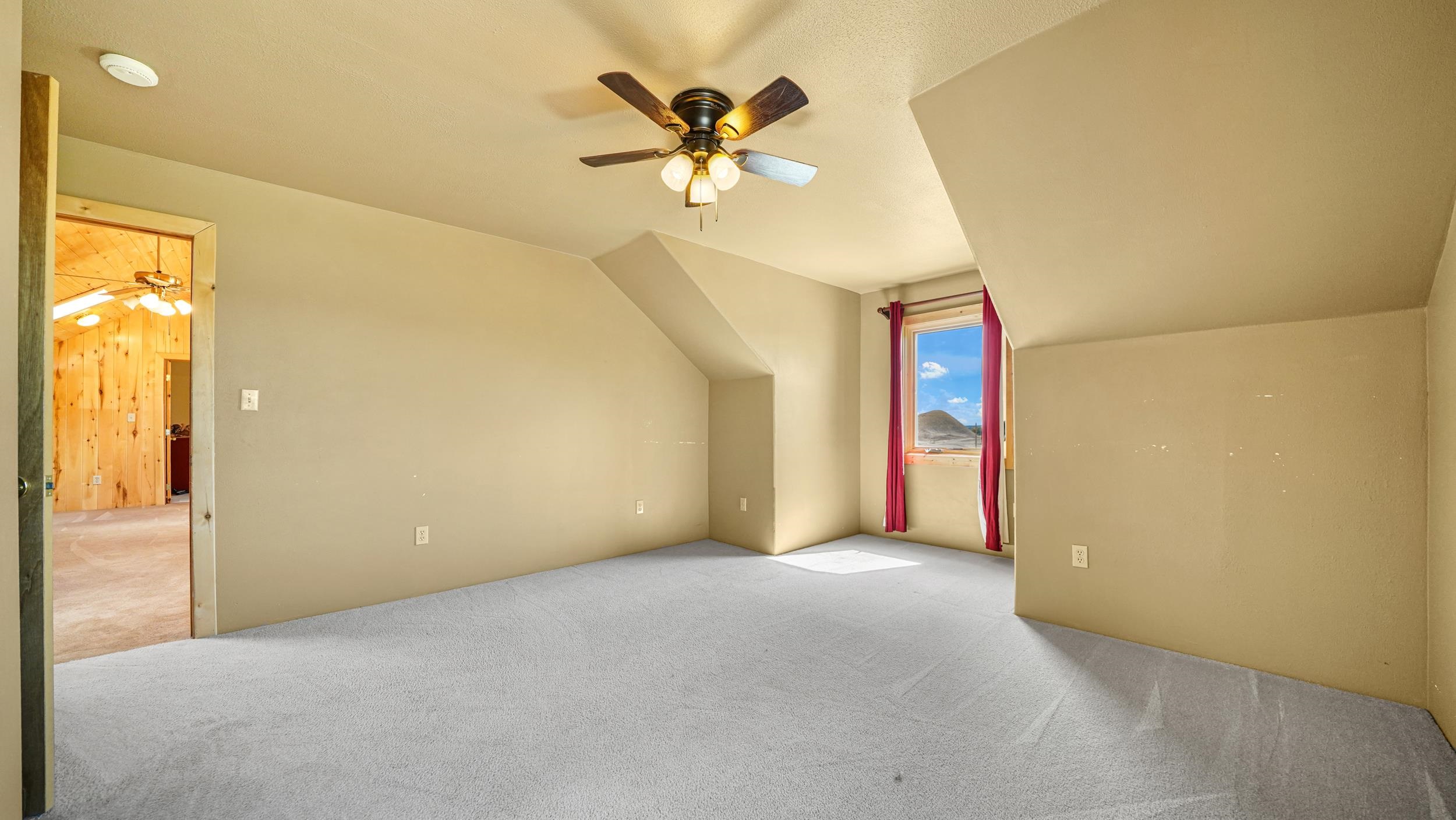 863 1400th Lane Delta, CO 81416 - Photo 25 of 42 a view of an empty room with a ceiling fan