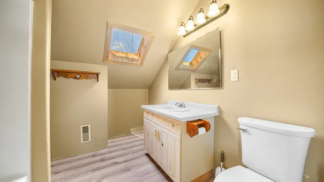 a bed room with a bed and a ceiling fan