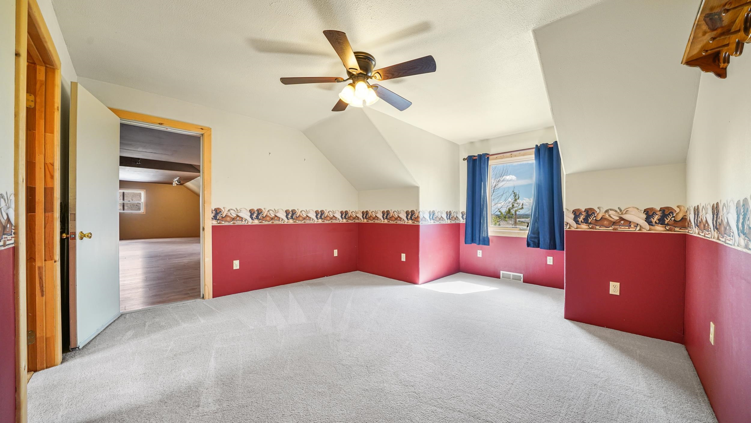 863 1400th Lane Delta, CO 81416 - Photo 27 of 42 a bed room with a bed and a ceiling fan