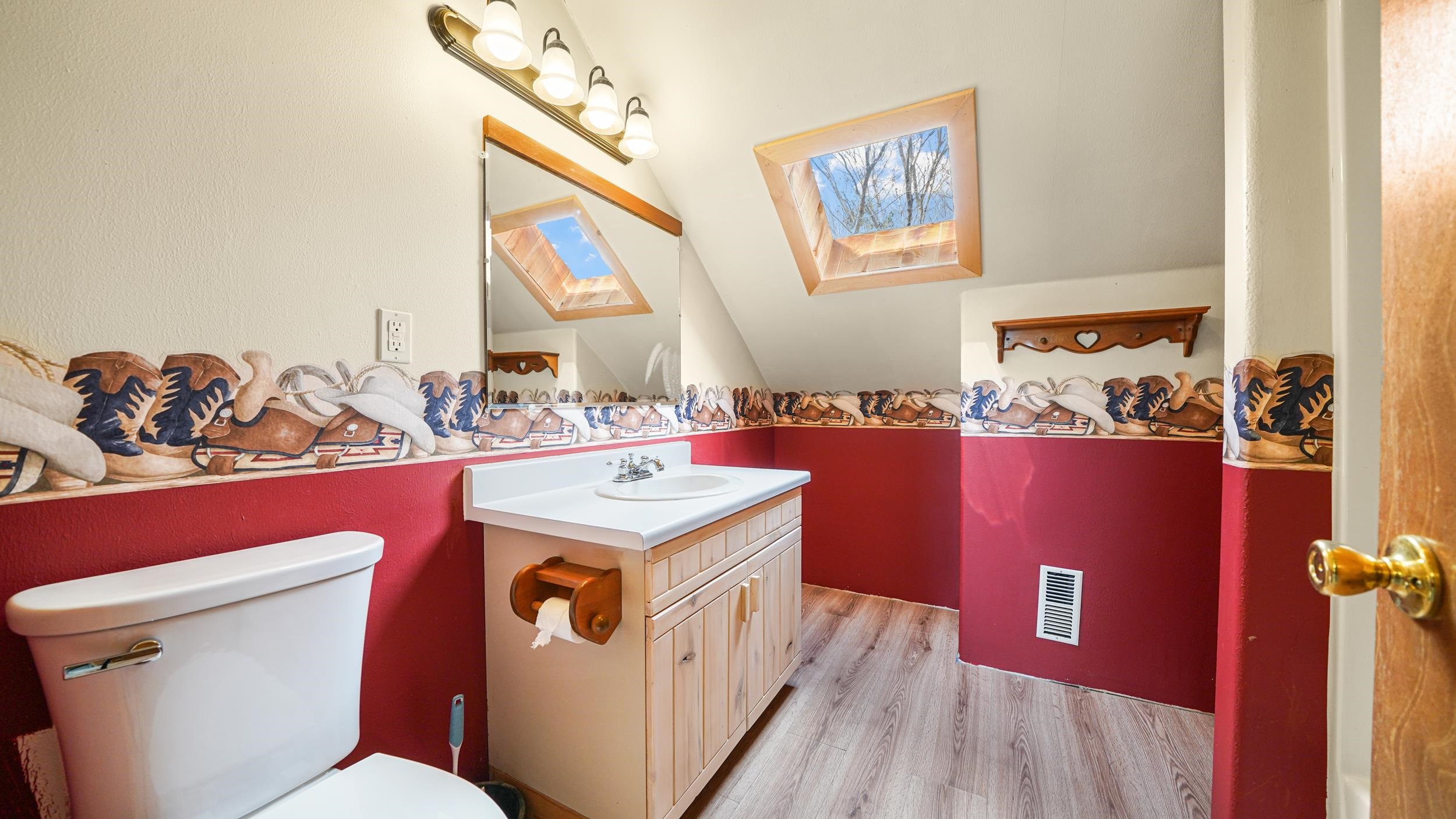 863 1400th Lane Delta, CO 81416 - Photo 28 of 42 a bathroom with a sink a toilet and mirror