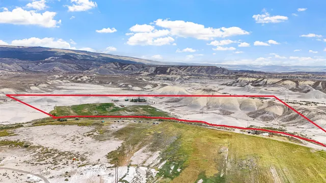 a view of an empty room and mountains