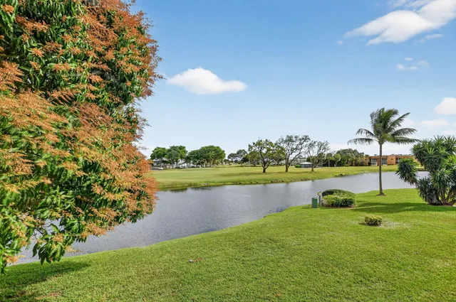 a kitchen with stainless steel appliances granite countertop a refrigerator stove a sink and dishwasher